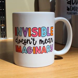 Invisible ≠ Imaginary — Pastel Awareness Mug