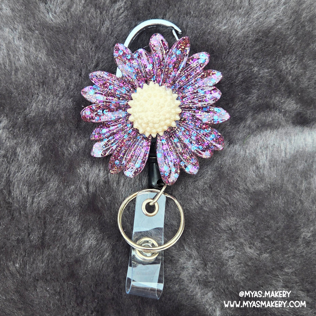 Supernova floral badge reel