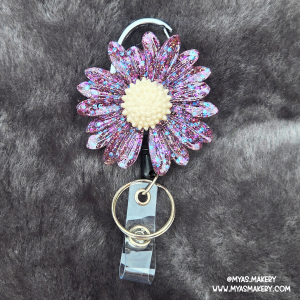 Supernova floral badge reel