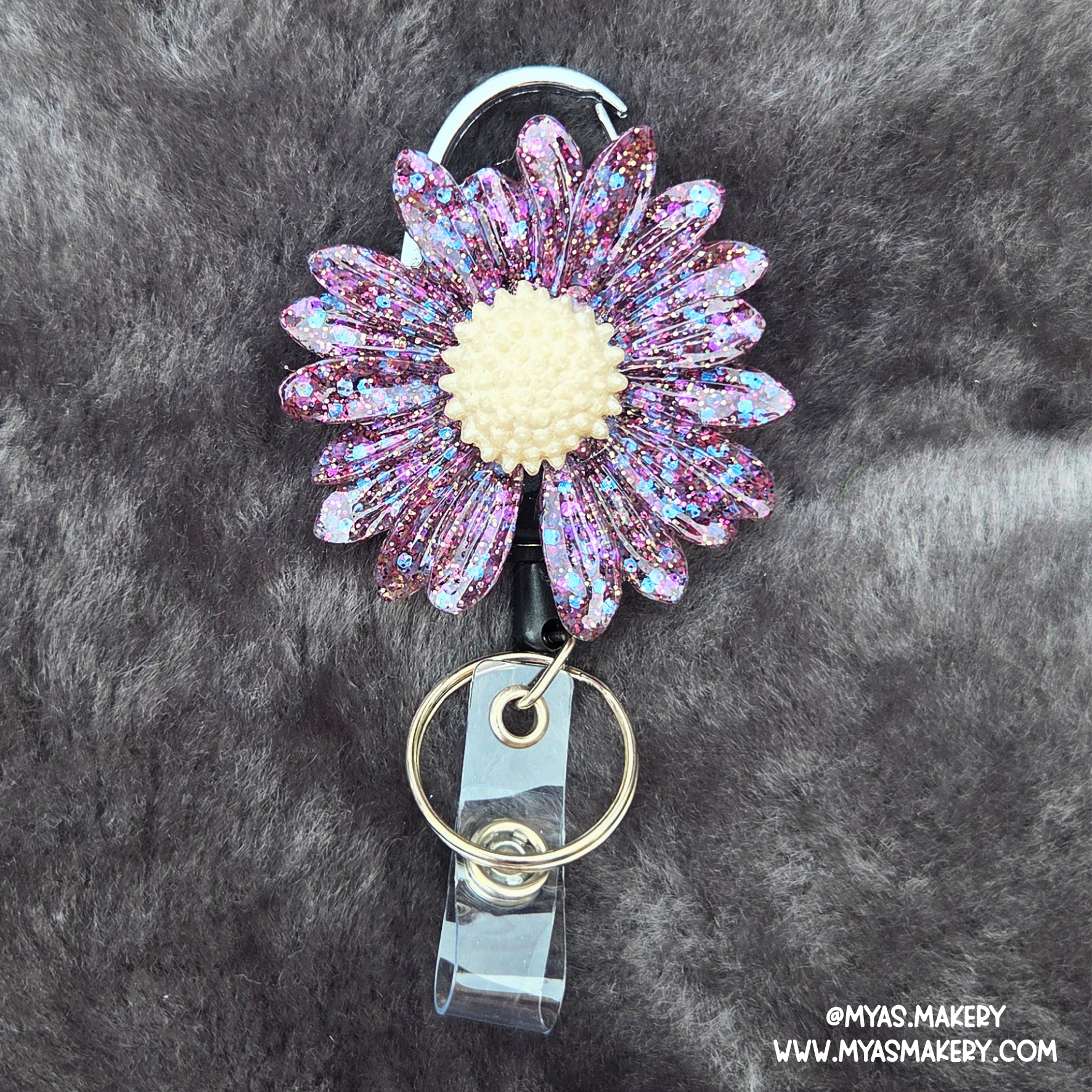 Supernova floral badge reel