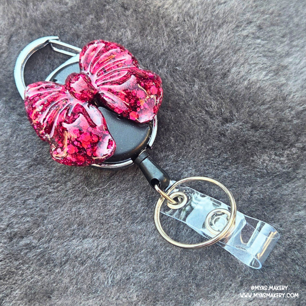 Ruby Bow Badge Reel