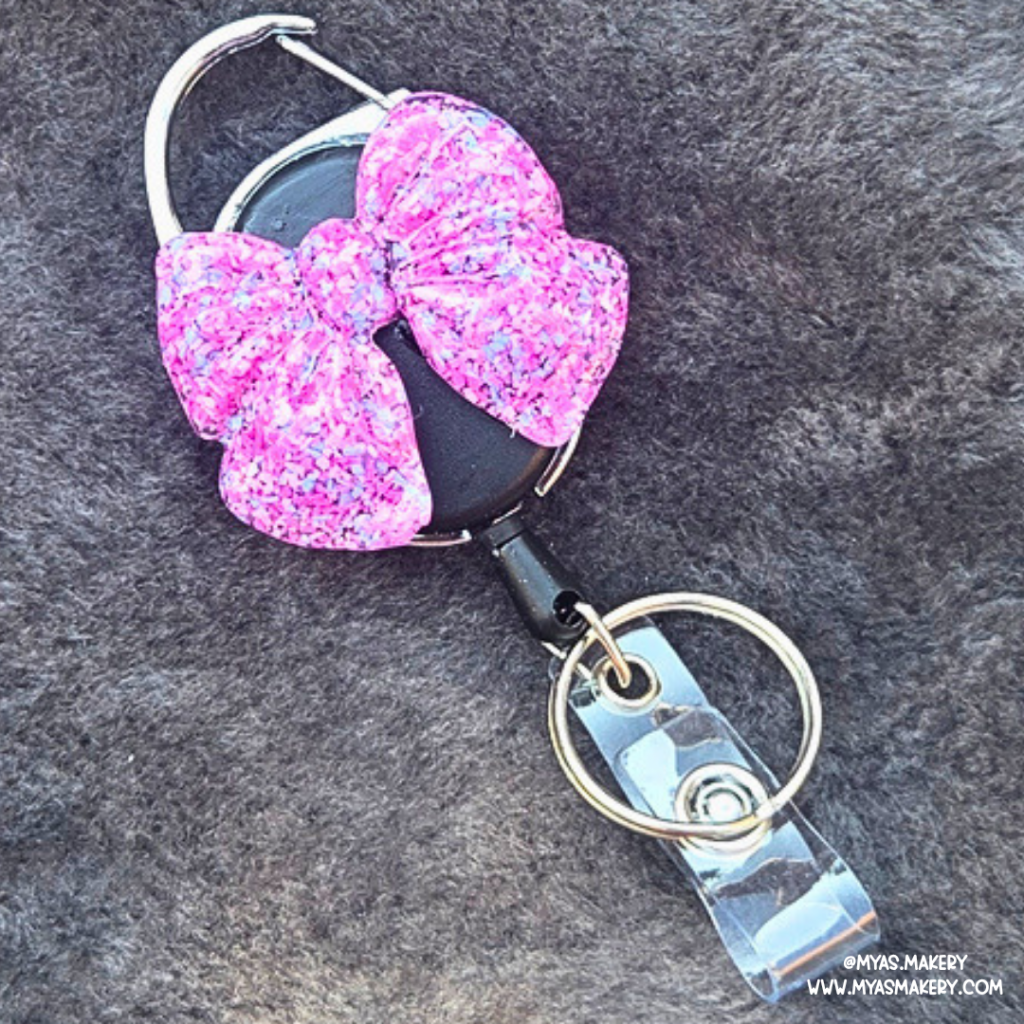 Cotton Candy Chaos Bow Badge Reel
