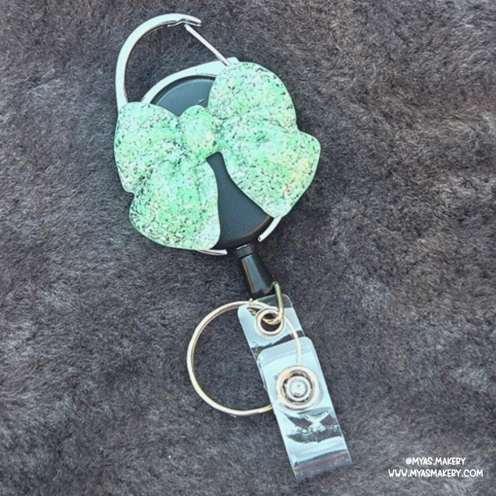 Neon Nugget bow badge reel