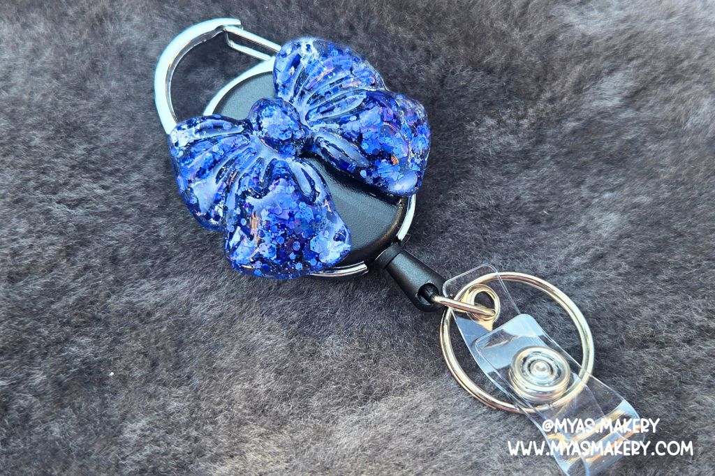 Blue Lagoon Bow Badge Reel